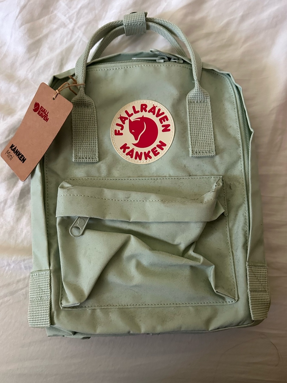 Fjallraven Kånken Mini Backpack in Light Sage with Red Logo